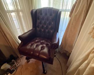 Burgundy tufted leather rolling office chair with nailhead trim