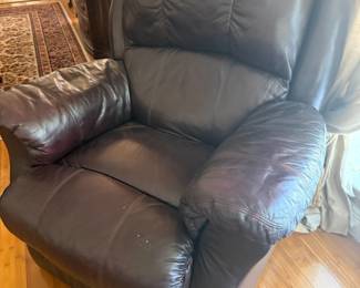 Burgundy leather recliner armchair with tufted back