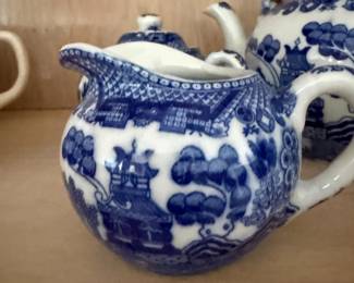 Blue willow china teapots with pagoda design, pair