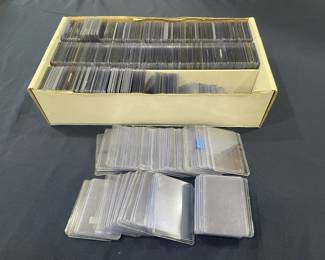 421h Large lot of sports cards hard sleeve top loaders