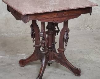 151 Victorian carved walnut parlor table with marble