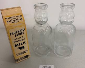 Dozens of antique milk bottles