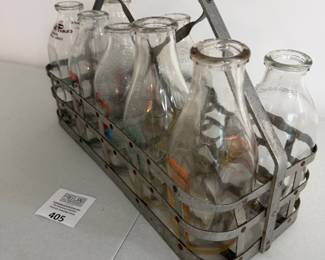 Dozens of antique milk bottles
