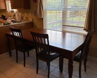 WoodFinish Dining Table with Three SlatBack Chairs