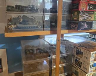 Military tanks and trucks in acrylic boxes