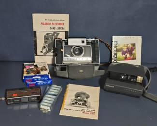 Vintage Polaroids - Land Camera and Spectra.  Polaroid film and a Sears camera with flip-flashes