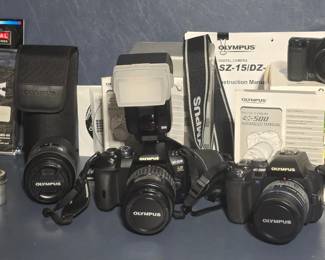Olympus Digital SLR Cameras E-500 & E-510, also Olympus SZ-15/DZ - books and manuals included.  Olympus Lens and 2 metal Kodak film cans ... the yellow one dated 1952!
