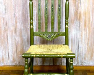 A green Hitchcock style side chair with rush seat