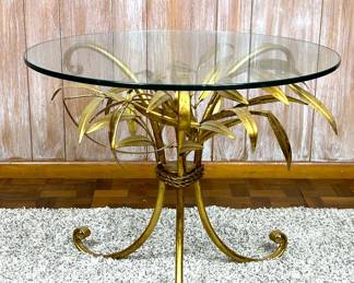 Hollywood Regency Italian gilded metal tole leaves side table with a round glass top