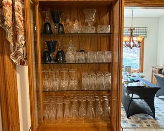 Glass-front cabinet filled with glassware
