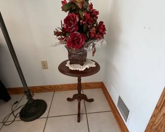 Floral arrangement with pedestal table