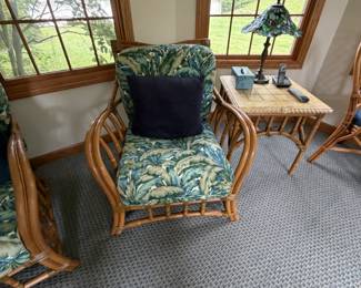 Rattan armchair with tropical cushions