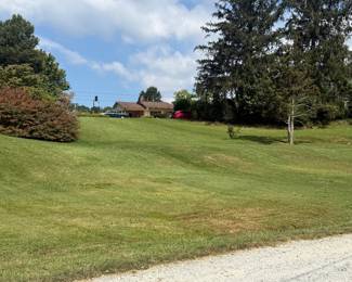 You will walk up a grassy incline from the parking area. There is some parking near the house for people that have difficulty with inclines..