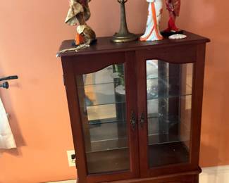 Asian figures and small vitrine