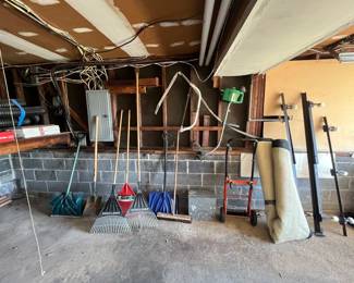 Rakes, weed wacker, shovels, Old Milk Man delivery case