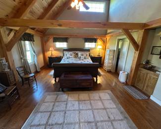 King size leather sleigh bed by Stanley with two matching nightstands. A towel rack and towel warmer for the bathroom. Oak jewelry chest with a ladder-back chair and a cane seat chair.