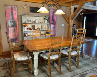 Dining table with 6 chairs. Two leaves can be added. Hand made narrow display cabinet.