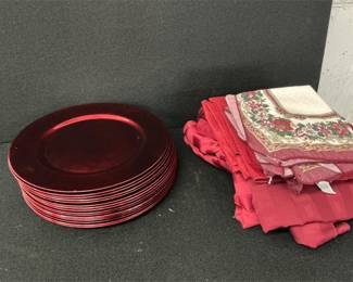 Red table linens and chargers