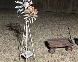 This is state feature some great exterior yard art including this windmill plus several Wheelbarrows that would make great planters as well as an incredible cast of aluminum Eiffel Tower. It’s like 5 feet tall.!!!