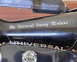 ANTIQUE UNIVERSAL SEWING MACHINE w/CABINET AND ACCESSORIES