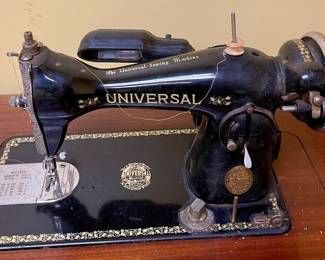 ANTIQUE UNIVERSAL SEWING MACHINE w/CABINET AND ACCESSORIES