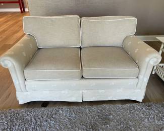 love seat with swirl details