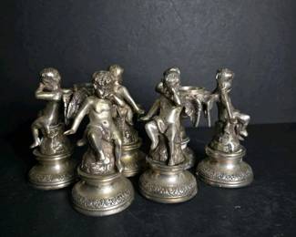 136 cherubstylemetalfiguralcandleholder