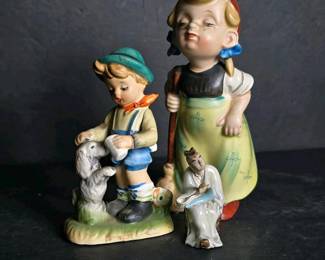 147 pairofarnartfigurineswithboygirld