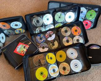 Over 500 Assorted Music CDs Stored in Binder Organizers