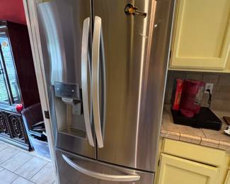 Side by Side with freezer at bottom. Ice and water dispenser