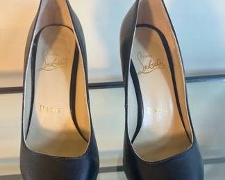 Christian Louboutin Pigalle black leather pointedtoe pumps.