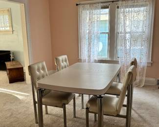 Funky 60s or 70s unique Formica dining table with chairs. Chairs are a bit beat up but I think they still look great! Chrome legs!