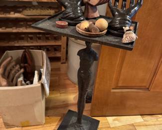 Figure heavy, metal brutalist table