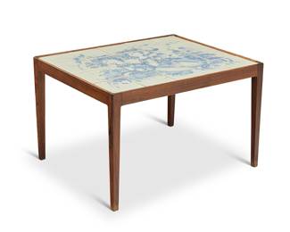 2329 Bjørn Wiinblad (1918-2006) A tile-top coffee table, 1969 The blue on white glazed tiles depicting a bucolic scene of two ladies, set in a wood frame Signed and dated at lower left: Bjorn Wiinblad / -69 Height 19 in., width 29 1/2 in., depth 24 1/4 in. Estimate: $500 - $700