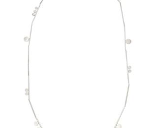 2239 Betty Cooke (1924-2024) A sterling silver necklace with scattered silver discs applied to various lengths of tubular silver beads, late 20th/21st century Stamped: Cooke / Sterling 37 in. approximately 23.1 grams Estimate: $1,000 - $1,500