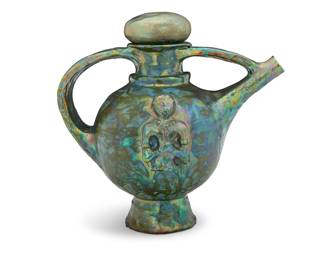 2199 Beatrice Wood (1893-1998) A lustre glazed earthenware ewer, 1989 With stopper, the body molded with figures to each side depicted with hands clasped together Signed and dated to underside: BEATO; numbered to foot rim: B 176 Height 13 1/4 in., width 14 in., depth 9 in. Estimate: $1,000 - $2,000
