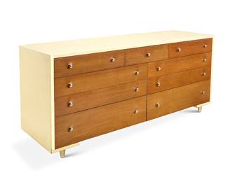 2030 Paul Frankl (1886-1958) A cork top dresser for Johnson Furniture Co., mid-20th century With nine drawers and white cork-wrapped top and sides, raised on gold-toned metal conical legs Factory burn mark to drawer interior Height 32 1/2 in., width 72 1/2 in., depth 22 in. Estimate: $700 - $900