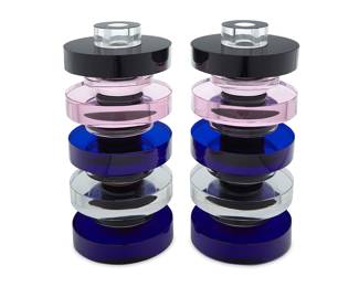 2315 Arik Levy (b. 1963) A pair of 'Giants' glass candlesticks for Gaia & Gino, early 21st century Designed 2007 Stacked clear, blue, pink, and black glass cylinders, each with original factory formed box Each etched with factory marks 2 pieces Height of each 10 5/8 in., diameter 4 3/4 in.; height of each box 6 3/4 in., width 12 5/8 in., depth 7 1/8 in. Estimate: $500 - $700