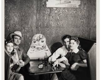 2333 Marion Post Wolcott (1910-1990) "Two Couples in a Juke Joint" (near Moore Haven, Florida), 1939 Gelatin silver print on paper Inscribed in pencil verso: "Young people in juke joint - bar table / in the vegetable section of the / Belle Glade area / 239 / 57094D / MPW 0007"; titled and dated on a gallery label affixed to the verso of the back mat Image: 13 5/8 x 10 3/8; Sheet: 14 x 11 1/8 in. Estimate: $600 - $800