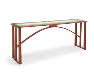 2216 Randy Bader (20th Century) A Contemporary console table, 2006 With inset glass top and arched stretcher Etched with signature and date: Randy Bader / woodworking / 3-3-2006 Height 30 1/4 in., width 72 in., depth 14 1/4 in. Estimate: $400 - $600