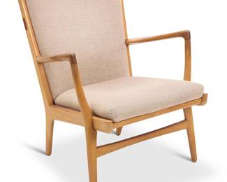 2033 Hans Wegner (1914-2007) A Model AP16 lounge chair for A. P. Stolen, mid-20th century Designed 1951 Later reupholstered in a pink cotton fabric to seatback and seat cushion, with metal springs underneath seat Thrice stamped with factory marks to seat rail underside Height 32 1/2 in., width 27 1/2 in., depth 31 1/2 in. Estimate: $1,000 - $1,500