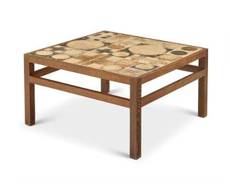 2012 Tue Poulsen (b. 1939) A tile-top square coffee table, late 20th century The glazed stoneware top set in a wood frame Marked to applied metal label: ILLUMS BOLIGHUS / KOBENHAVN Height 16 in., width 27 1/4 in., depth 27 1/4 in. Estimate: $500 - $700
