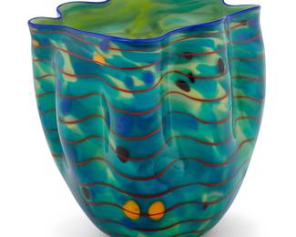 2067 Dale Chihuly (b. 1941) "Ocean Macchia," 2002 Glass in studio custom acrylic case Etched signature and number: Chihuly / PP02 Together with hardcover book: Hobbs, Robert (essay). "Chihuly alla Macchia." Beaumont, TX: Art Museum of Southeast Texas, 1999 2 pieces Height of glass 9 3/8 in., width 8 5/8 in., depth 8 3/8 in.; height of case 14 in., width 12 5/8 in., depth 12 5/8 in. Estimate: $2,000 - $4,000
