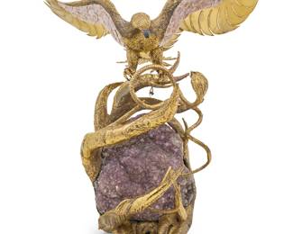 2084 Isabel Masson-Faure (b. 1940) & Richard Faure (20th Century) A gilt metal and amethyst figural group as an illuminated fountain, late 20th century Depicting an eagle with mica overlay above a snake twisted between branches of gnarled vines, set with three lights and housing a fountain with motor, centered by an amethyst specimen, electrified Etched with signature: Richard Faure Height of lower element 35 in., width 22 1/2 in., depth 25 1/2 in.; height of eagle 30 in., width 46 1/4 in., depth 18 in.; height overall 52 1/2 in. Estimate: $3,000 - $5,000