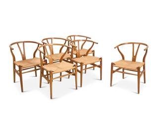 2051 Hans Wegner (1914-2007) A set of six 'Wishbone' armchairs model CH 24 for Carl Hansen & Son, mid-20th century With Y-form backs and woven natural cord seats Four burn marked: Made in Denmark / By Carl Hansen & Son / Odense, Denmark; two with factory foil label and impressed: BB6 6 pieces Height of each 28 1/2 in., width 21 in., depth 21 in. Estimate: $2,000 - $4,000