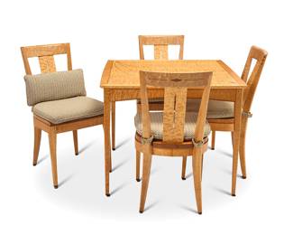 2214 An A. L. Swanson maple table and set of four chairs 2011-2012 Comprising a burlwood veneer table with foliate inlay top, and a set of four side chairs with associated seat cushions Table signed and dated to underside in ink: November 2011 / Helena, Montana / A L Swanson; each chair signed, dated, and inscribed: Handmade with pride for / [redacted] / January 2012 / A L Swanson 5 pieces Height of table 30 1/4 in., width 36 3/4 in., depth 36 3/4 in.; height of each chair 36 1/2 in., width 19 1/2 in., depth 23 1/2 in. Estimate: $1,000 - $2,000