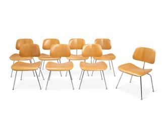 2050 Charles and Ray Eames (1907-1978 and 1912-1988) A set of eight DCM chairs for Herman Miller, 1984-1999 Designed 1946 Each with a molded plywood seat and backrest on a tubular chromed steel frame with rubber shock mounts and plastic glides One with black factory label applied to underside 8 pieces Height of each 30 1/8 in., width 19 1/2 in., depth 21 1/4 in. Estimate: $1,000 - $2,000