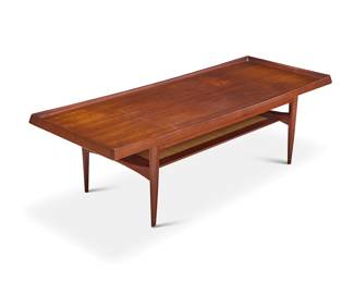 2034 An MM Moreddi teak and rattan coffee table Mid-20th century The top with molded edges above a rattan undertier, raised on attenuated legs Factory burn mark to underside Height 17 1/4 in., width 55 in., depth 21 3/4 in. Estimate: $400 - $600