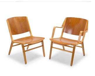 2036 Peter Hvidt (1916-1986) & Orla Molgaard Nielsen (1907-1993) Two 'Ax' chairs for Fritz Hansen, 1950s Comprising one armchair and one lounge chair, each laminated molded mixed plywood Lounge chair with applied label foil factory label, numbered: 0663; armchair with later burn mark: PROPERTY BRANDEIS UNIVERSITY 2 pieces Height of armchair 30 in., width 24 in., depth 27 1/2 in.; height of lounge chair 30 1/2 in., width 20 in., depth 27 in. Estimate: $800 - $1,200