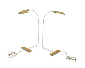 2319 Cedric Hartman (b. 1929) A pair of brass 'Swivel' floor lamps, late 20th century The single-light lamps each with brass base issuing a rotating and extendable chromed metal tubular standard, electrified Each base with impressed factory marks and numbered: CEDRIC HARTMAN / [script signature] / 800350 2 pieces Lowest height of each 35 3/4 in., width 11 in., depth 21 in. Estimate: $1,000 - $2,000